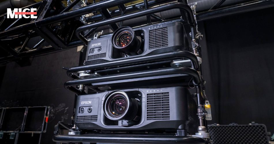 Projector Rental in Thailand, AV equipment setup for a corporate event in Bangkok, featuring microphones, speakers, and a projector