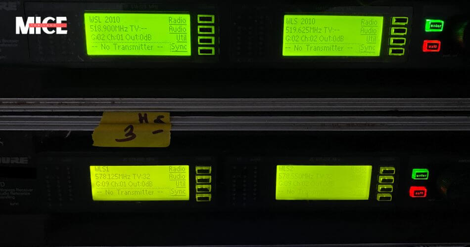 close up wireless microphone rental ready for use at a conference in Phuket, Thailand, emphasizing high-quality audio equipment rental