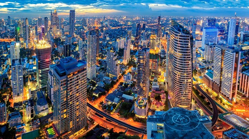 Bangkok cityscape at dusk with illuminated skyscrapers — MICE events and conference destination in Thailand